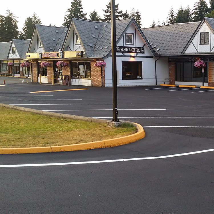 Professional Line Painting Freshly painted lines in an asphalt parking lot in Parksville, BC